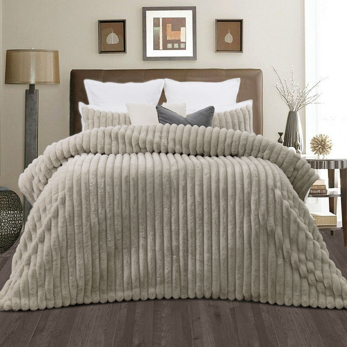 Channel stitched natural faux fur comforter set with two pillowcases on a king bed