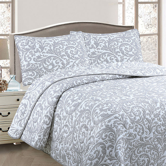 Slimbridge grey and white foliage jacquard coverlet on a Queen bed