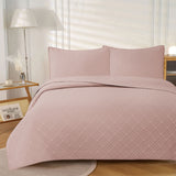 Frampton on Severn blush embossed reversible coverlet on a Queen bed