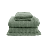 Avocado green four piece cotton towel set with two bath towels, hand towel and bath mat