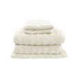 Snow white four piece cotton towel set with two bath towels, hand towel and bath mat