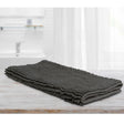 Large charcoal microfibre bath mat with a toggle applique design on a bathroom floor