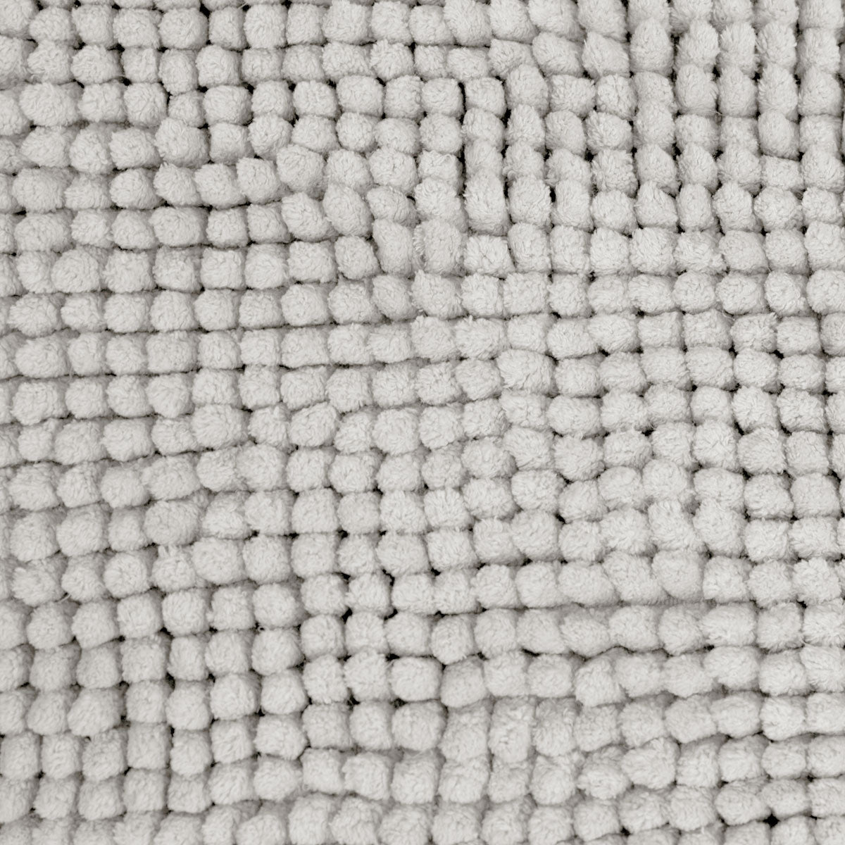 Silver microfibre bath mat shown beside a bath with its non slip backing on tile