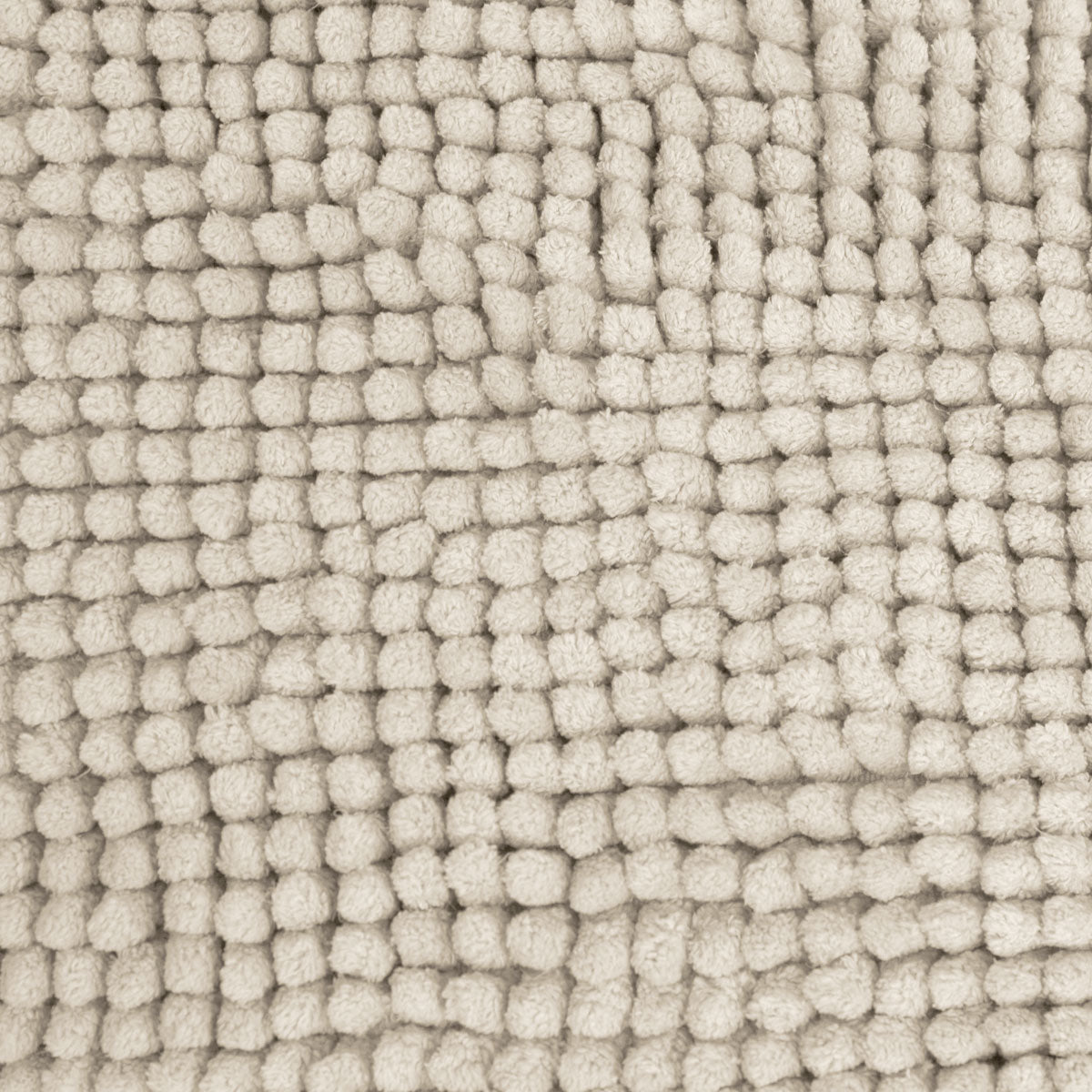 Stone bath mat shown beside a bath with its non slip backing