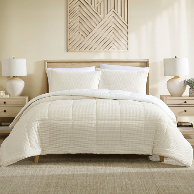 Cream velvet comforter set with a sherpa reverse and two pillowcases on a made bed