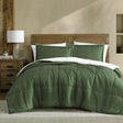 Colesbourne deep khaki stitch print comforter with plush sherpa reverse on a Queen bed