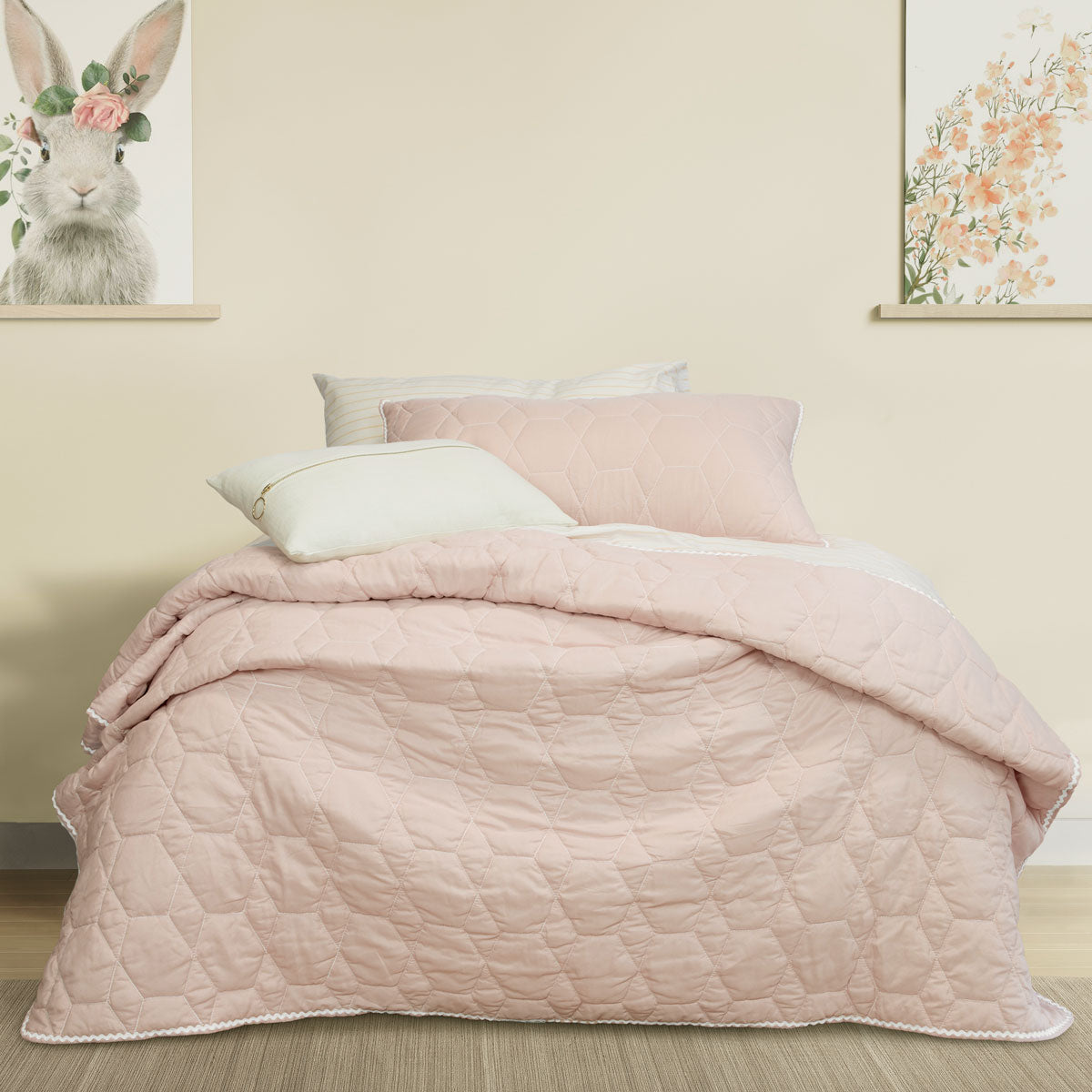 Randwick pink geometric kids coverlet on a single bed