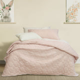 Randwick pink geometric kids coverlet on a single bed