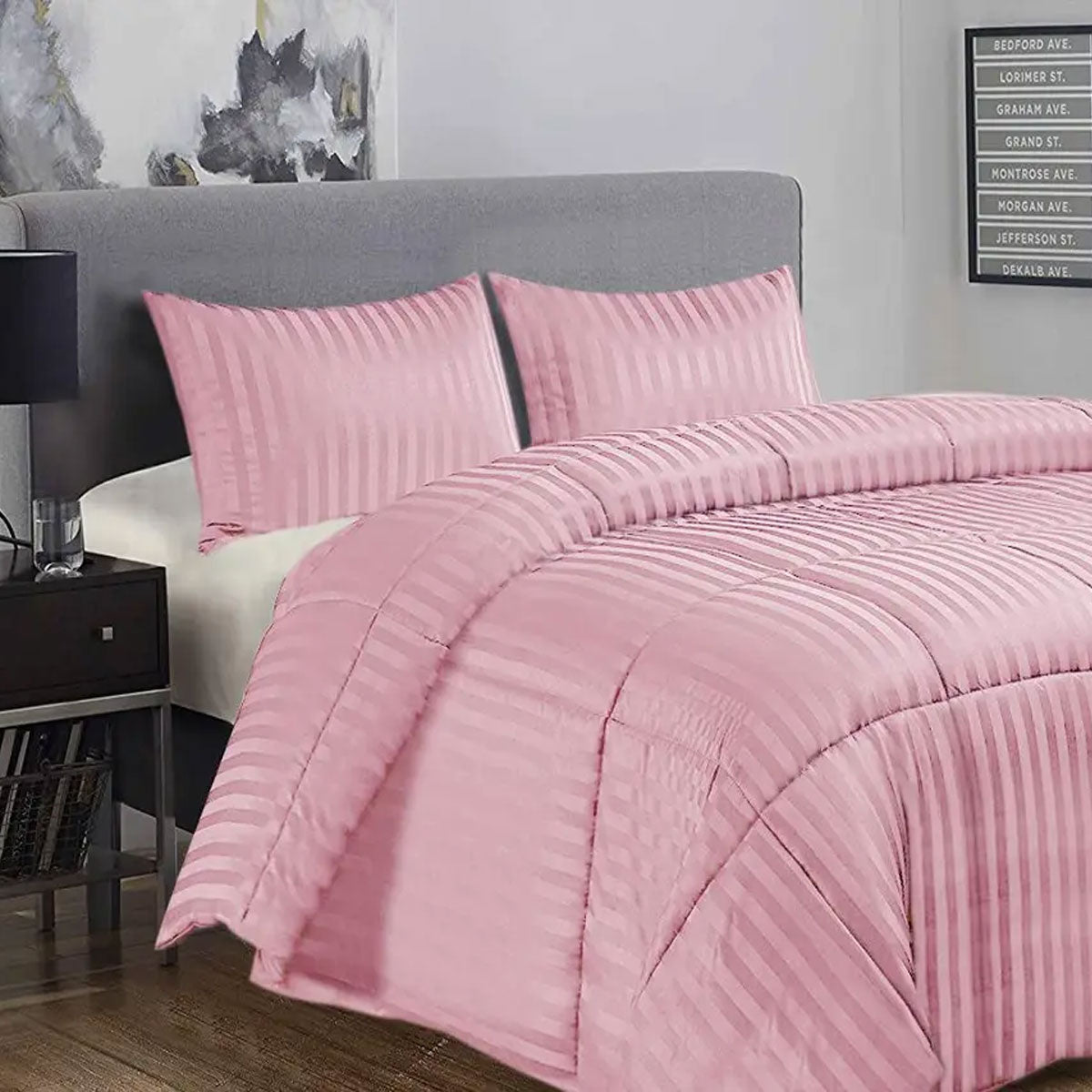 Baunton pink damask stripe comforter set on a King bed with two pillowcases