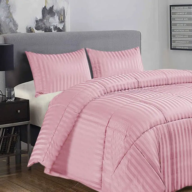 Baunton pink damask stripe comforter set on a King bed with two pillowcases