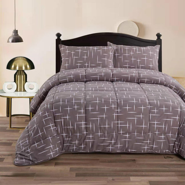 Charcoal and white mink flannel comforter with quilted squares and two pillowcases on a King bed