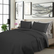 Kineton charcoal cooling embroidered comforter set on a King bed with two pillowcases