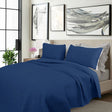Kineton Nobility cooling embroidered comforter set on a King bed with two pillowcases