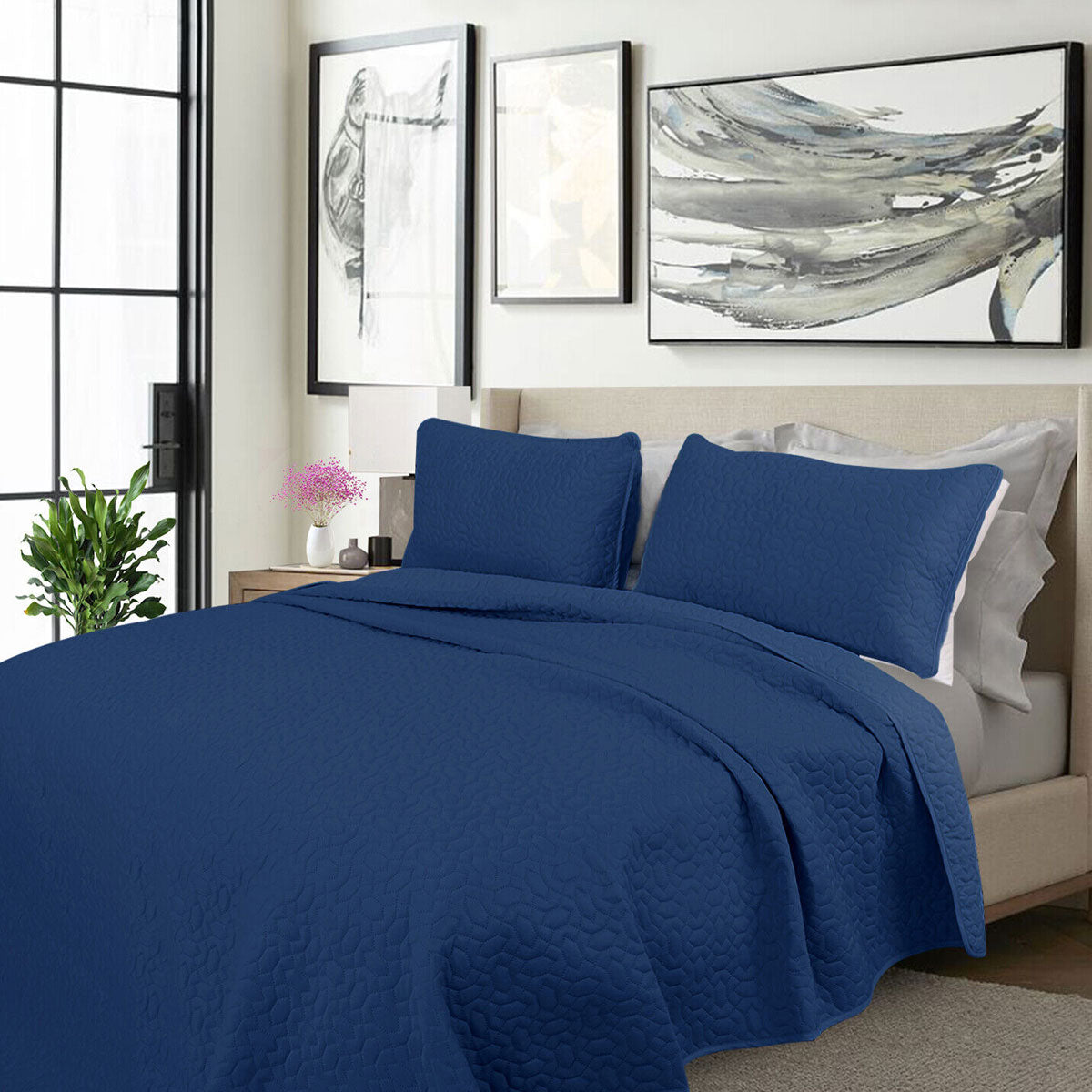 Kineton Nobility cooling embroidered comforter set on a King bed with two pillowcases