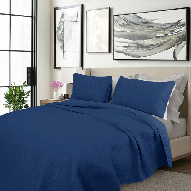 Kineton Nobility cooling embroidered comforter set on a King bed with two pillowcases