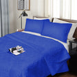 Mickleton royal blue ultrasonic damask comforter on a King bed