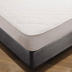 Criccieth quilted cotton fitted mattress protector single on a made bed