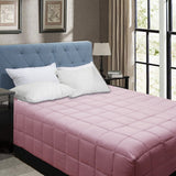 Postlip dusty pink microfibre box end quilt with lofty cassette stitching on a Queen bed