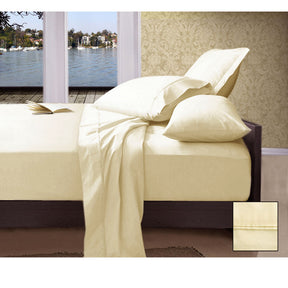 San Gimignano ivory 1000TC Pima cotton sheet set on a queen bed