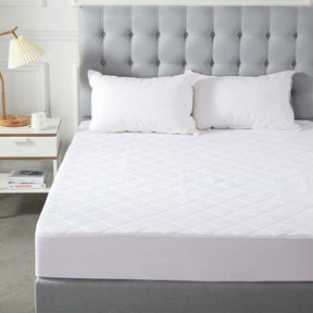 Rhossili white quilted microfibre fitted mattress protector double on a made bed