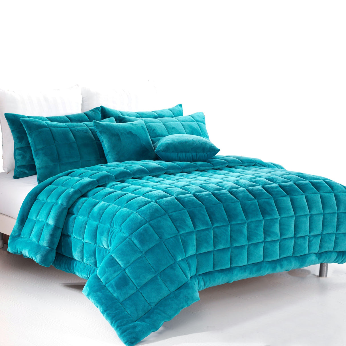 Sherborne emerald green faux mink quilted comforter set on a King bed with two pillowcases