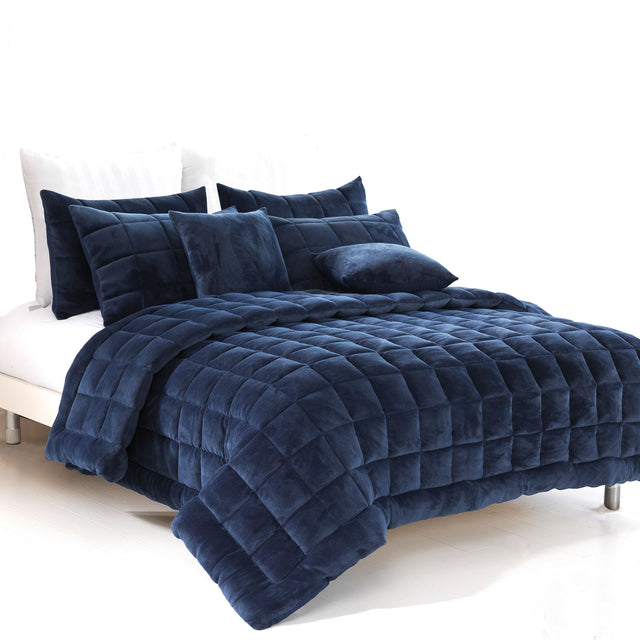 Sherborne navy faux mink quilted comforter set on a King bed with two pillowcases