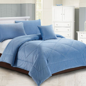 Dowdeswell chambray blue diamond quilted comforter set on a King bed with two pillowcases