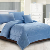 Dowdeswell chambray blue diamond quilted comforter set on a Super King bed with two pillowcases