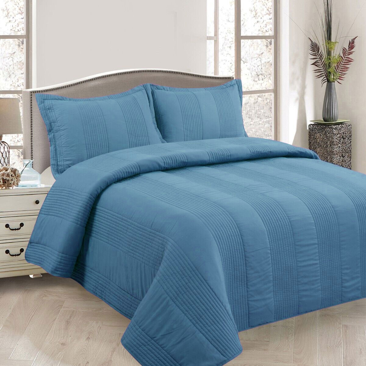 Arlington blue pintuck quilted coverlet set on a Queen bed with matching pillowcases