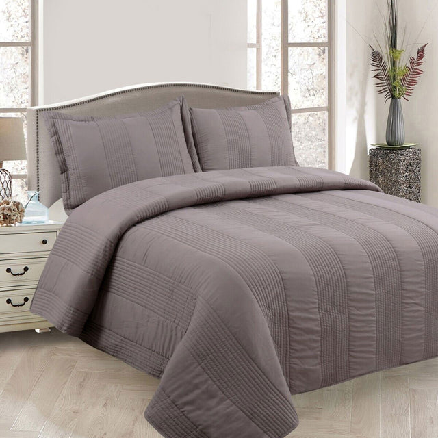 Arlington mocha pintuck quilted coverlet set on a Queen bed with matching pillowcases
