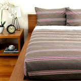 Little Rissington almond vertical stripe comforter set on a King bed with two pillowcases