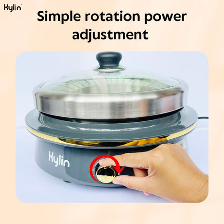 Removable stainless steel inner pot lifted from the electric hotpot base