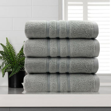 Four silver 650 GSM cotton face washers, 33 x 33 cm, folded to show the contrasting dobby stripe border