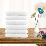 Set of six white combed cotton face washers, 500 GSM, 30 x 30 cm, folded and stacked with dobby border detail