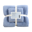 Blue coral fleece towels hanging on a rail to dry
