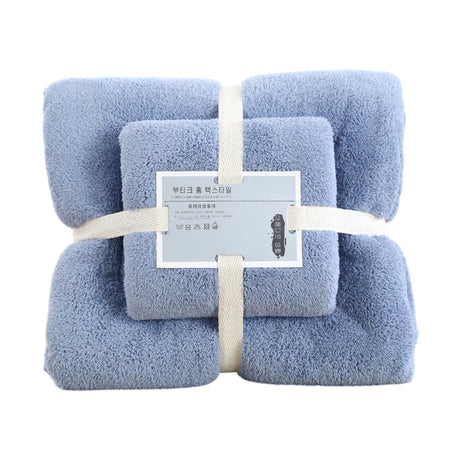 Blue coral fleece towels hanging on a rail to dry