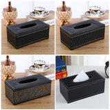Woven black tissue box holder styled on a bathroom vanity
