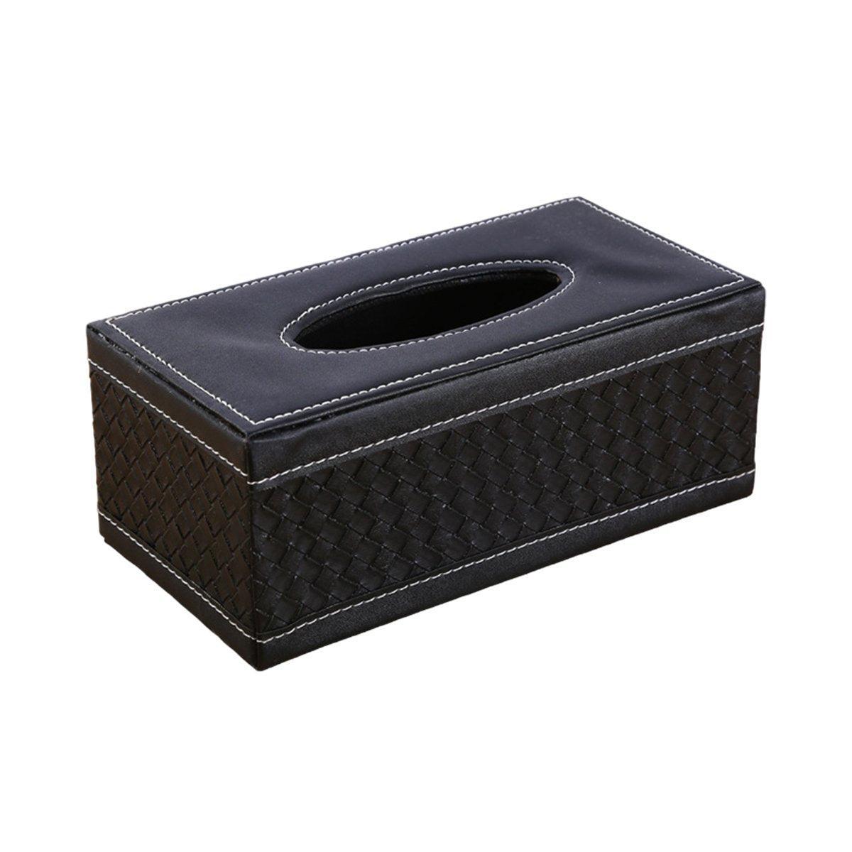 Tissue box holder in black leather look finish on a bedside table