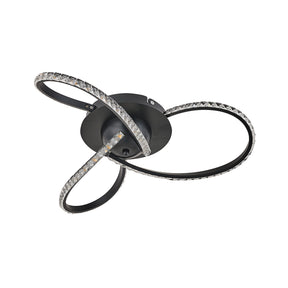 Lerici black three light crystal LED ceiling light above a dining table