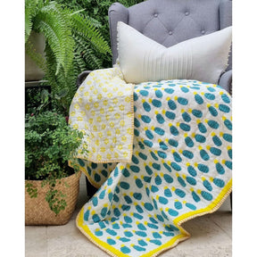 Organic cotton reversible baby quilt in blue pineapple print