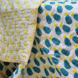 Organic cotton reversible baby quilt in blue pineapple print