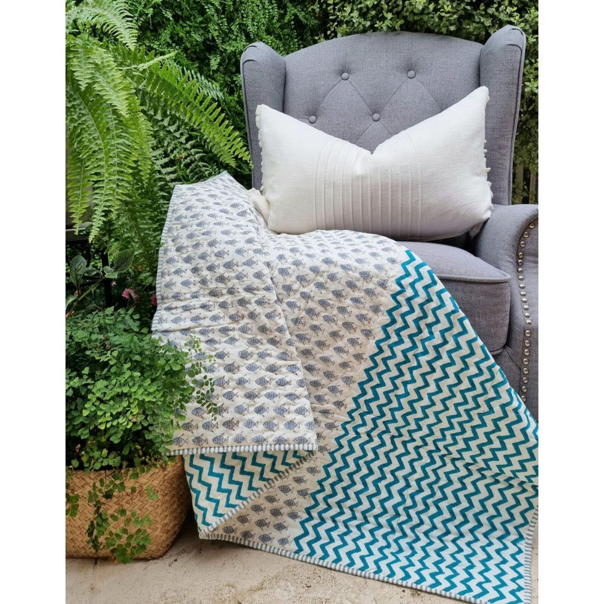Organic cotton reversible baby quilt in blue little fish print