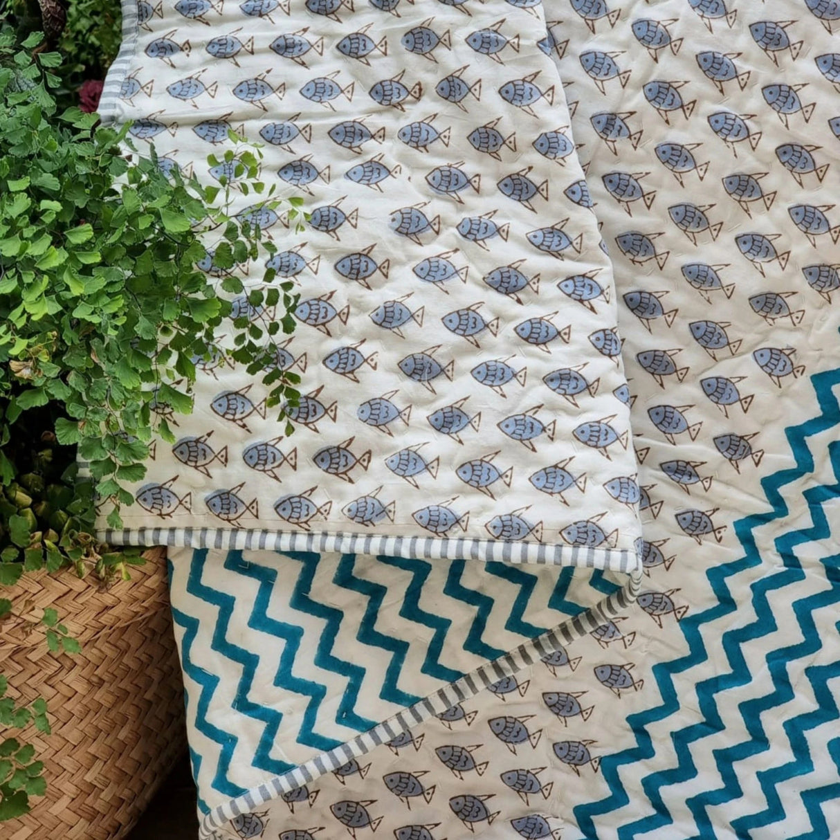Organic cotton reversible baby quilt in blue little fish print