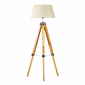 Hollis bamboo tripod floor lamp with beige linen shade in a living room