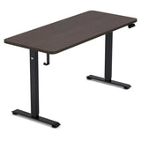 Reid walnut electric standing desk with black frame in a home office