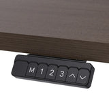 Reid walnut electric standing desk with black frame in a home office