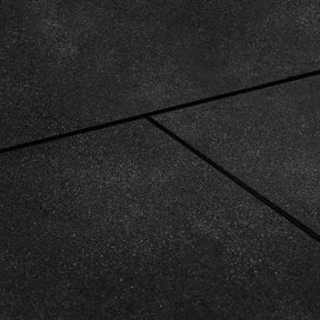 Thirty six black rubber gym tiles forming a large training floor