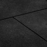 Large coverage of black bevelled edge rubber gym floor tiles in a commercial gym