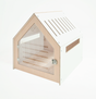 Collie modern dog crate in white with a clear acrylic perspex door and soft cushion in a living room