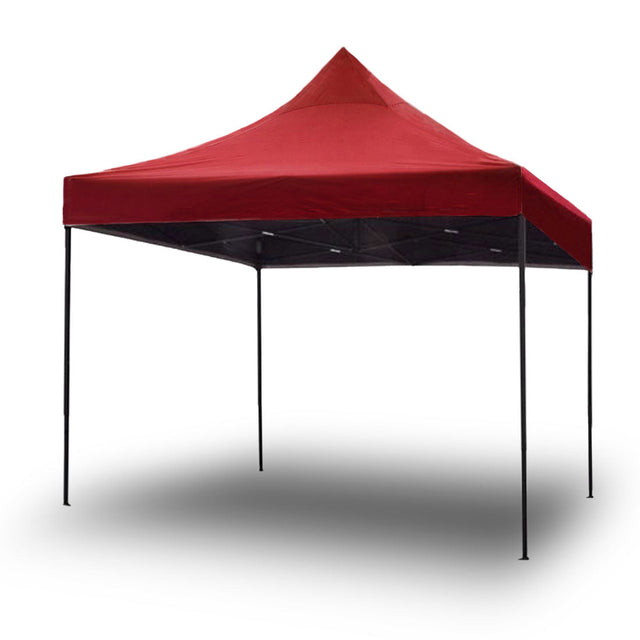Red 3 x 3 m pop up gazebo set up outdoors on grass